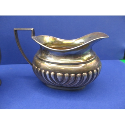 209 - A sterling silver cream jug and a continental example, both in good used condition, approx. gross pa... 