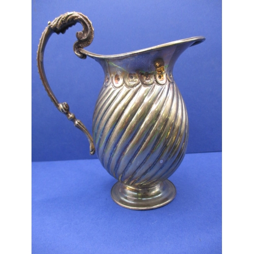 209 - A sterling silver cream jug and a continental example, both in good used condition, approx. gross pa... 