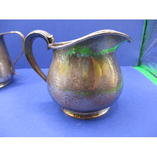 221 - A Danish 925 silver cream jug and a Victorian silver example, both in good used condition, approx. g... 