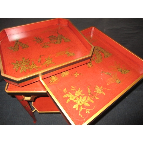 313 - A vintage oriental red lacquer ware two tier tray table, approx. dimensions H: 60cm W: 47cm D: 43cm ... 