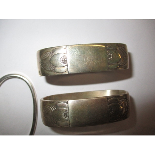 211 - 4 Georg Jensen Denmark silver napkin rings, to include 1 pair, all in good used condition, approx. g... 