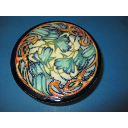 280 - A Moorcroft limited edition lidded pot with original box and in good condition, approx. diameter 16c... 