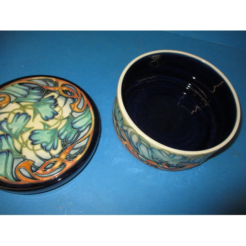 280 - A Moorcroft limited edition lidded pot with original box and in good condition, approx. diameter 16c... 