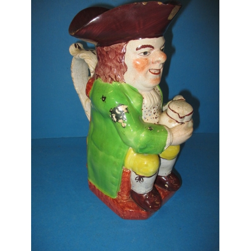 286 - An antique Toby Jug, dating c1830, approx. height 24.5cm having some enamel loss and minor chipping