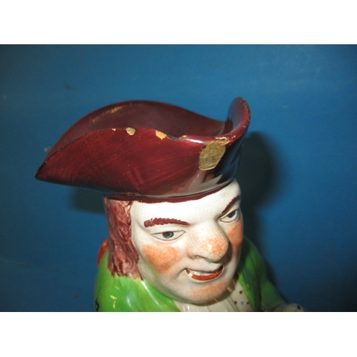 286 - An antique Toby Jug, dating c1830, approx. height 24.5cm having some enamel loss and minor chipping