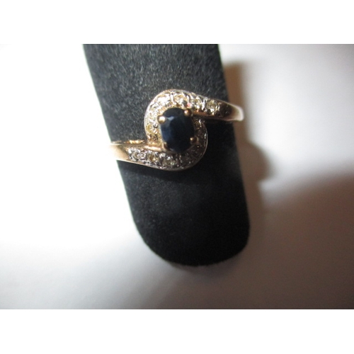 31 - A 9ct gold diamond and sapphire ring, approx. ring size ‘J’, approx. weight 1.7g in useable pre-owne... 