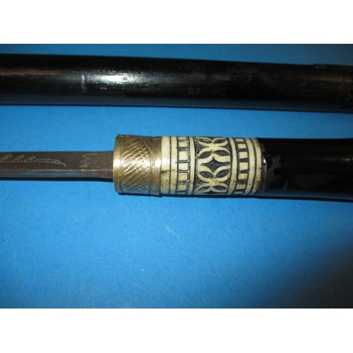 265 - A vintage Indian made sword stick, having age related ware and repairs, approx. length 88cm