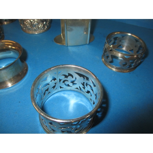 224 - A parcel of vintage sterling silver napkin rings, various makers, to include one boxed example all i... 