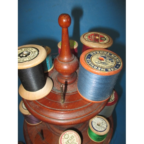 269 - A parcel of vintage sewing items, to include a Victorian mahogany cotton reel stand, with silver thi... 