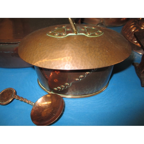 299 - A parcel of antique and later copper items to include an arts and craft tea caddy and jelly moulds, ... 