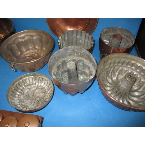 299 - A parcel of antique and later copper items to include an arts and craft tea caddy and jelly moulds, ... 