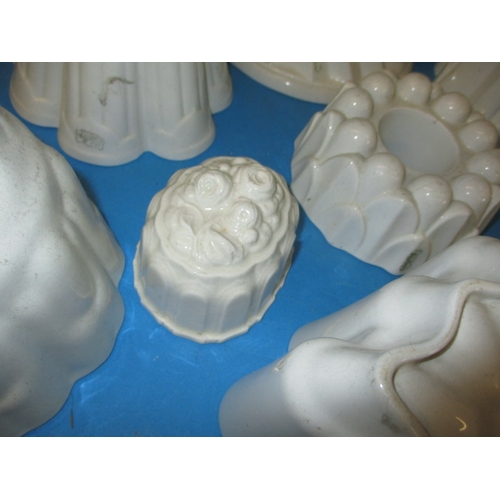 296 - A quantity of antique ceramic jelly moulds, to include examples by Shelley, all in used condition wi... 