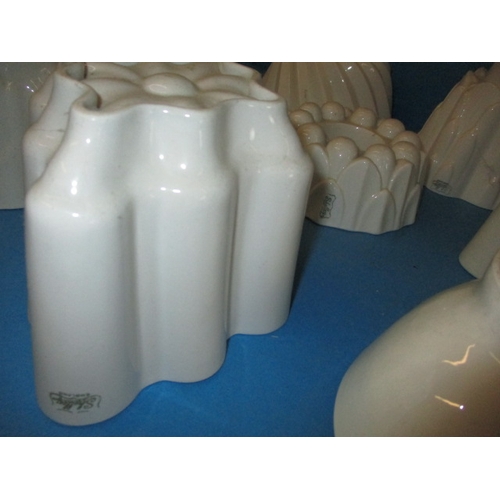 296 - A quantity of antique ceramic jelly moulds, to include examples by Shelley, all in used condition wi... 