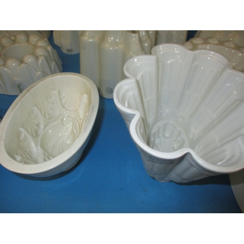 296 - A quantity of antique ceramic jelly moulds, to include examples by Shelley, all in used condition wi... 