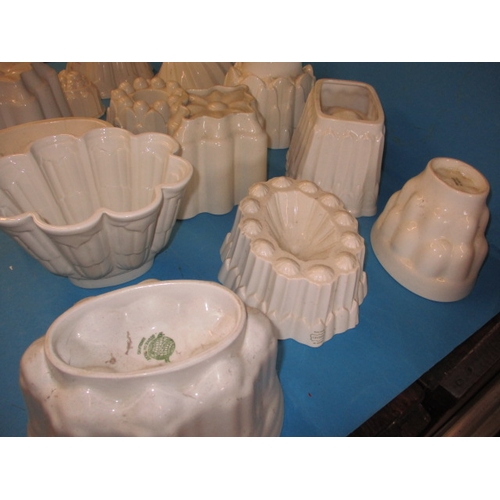 296 - A quantity of antique ceramic jelly moulds, to include examples by Shelley, all in used condition wi... 