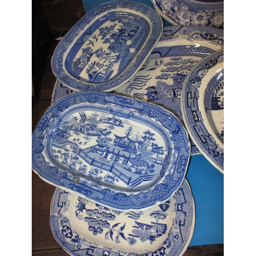 290 - A parcel of 19th century and later blue & white pottery platters, all in used condition, some minor ... 