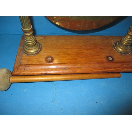 297 - A 1920s table gong, with original hammer, approx. diameter of metal gong 22cm, missing hammer rests,... 