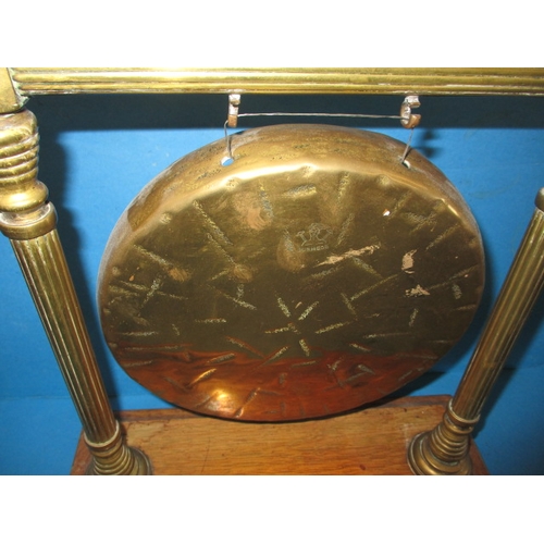 297 - A 1920s table gong, with original hammer, approx. diameter of metal gong 22cm, missing hammer rests,... 