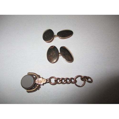 62 - A pair of 9ct gold cufflinks, and a 9ct chain fob, approx. gross parcel weight 15.5g , in good used ... 