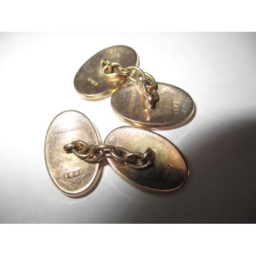 62 - A pair of 9ct gold cufflinks, and a 9ct chain fob, approx. gross parcel weight 15.5g , in good used ... 