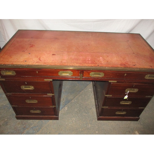 309 - A vintage campaign style desk with brass mounts and 8 drawers, comes in 3 parts for ease of transpor... 