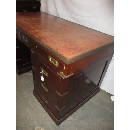 309 - A vintage campaign style desk with brass mounts and 8 drawers, comes in 3 parts for ease of transpor... 