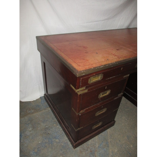 309 - A vintage campaign style desk with brass mounts and 8 drawers, comes in 3 parts for ease of transpor... 