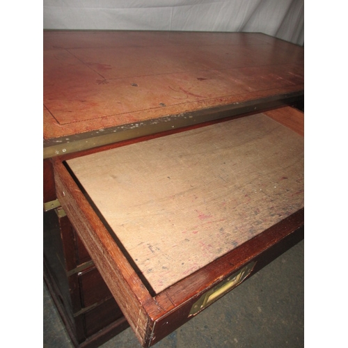 309 - A vintage campaign style desk with brass mounts and 8 drawers, comes in 3 parts for ease of transpor... 