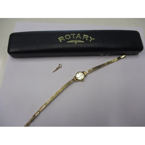 75 - A vintage 9ct gold ROTARY wrist watch with gold strap, and a 750 gold necklace pendant, in used cond... 