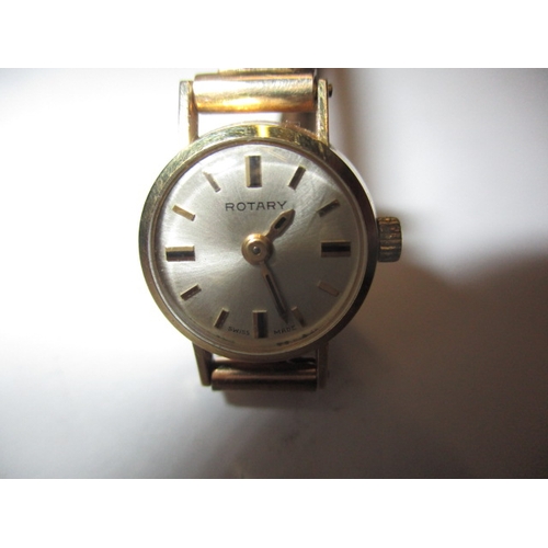 75 - A vintage 9ct gold ROTARY wrist watch with gold strap, and a 750 gold necklace pendant, in used cond... 