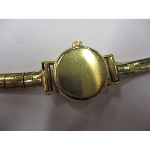 75 - A vintage 9ct gold ROTARY wrist watch with gold strap, and a 750 gold necklace pendant, in used cond... 