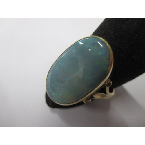 19 - An 18ct yellow gold natural opal ring, approx. ring size ‘M’ approx. stone size 19x11mm, approx. wei... 