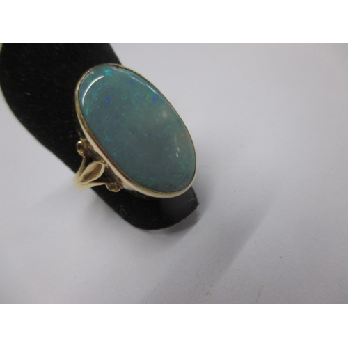 19 - An 18ct yellow gold natural opal ring, approx. ring size ‘M’ approx. stone size 19x11mm, approx. wei... 