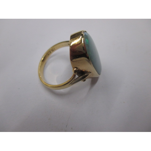 19 - An 18ct yellow gold natural opal ring, approx. ring size ‘M’ approx. stone size 19x11mm, approx. wei... 