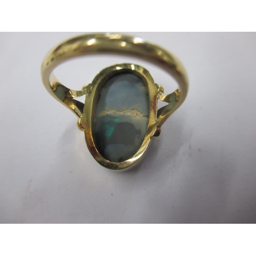 19 - An 18ct yellow gold natural opal ring, approx. ring size ‘M’ approx. stone size 19x11mm, approx. wei... 