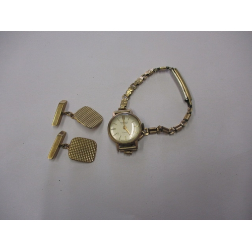 63 - A pair of 9ct yellow gold cufflinks, approx. gross weight 5.4g and a 9ct gold cased wrist watch, not... 