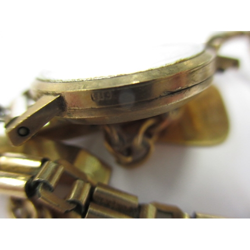 63 - A pair of 9ct yellow gold cufflinks, approx. gross weight 5.4g and a 9ct gold cased wrist watch, not... 