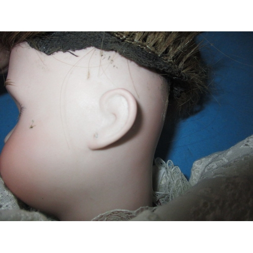 230 - An antique Jumeau? Porcelain head doll, having composite body and later clothes, one finger missing ... 