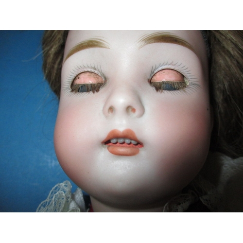 230 - An antique Jumeau? Porcelain head doll, having composite body and later clothes, one finger missing ... 