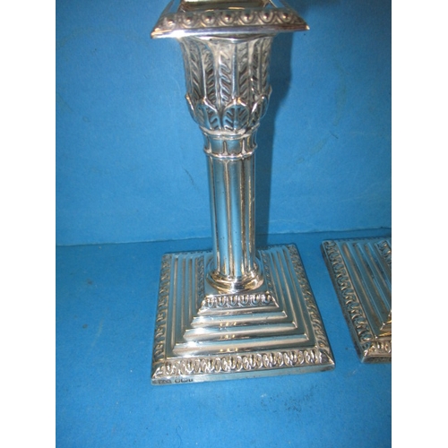 181 - A pair of Edwardian sterling silver candlesticks, approx. height 14cm makers mark T.A.S., in useable... 