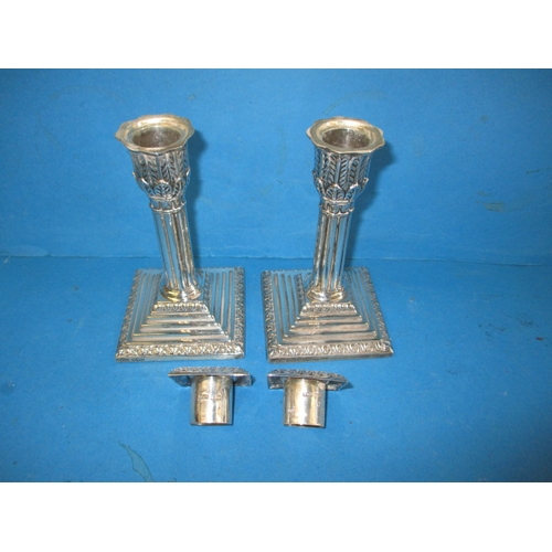 181 - A pair of Edwardian sterling silver candlesticks, approx. height 14cm makers mark T.A.S., in useable... 