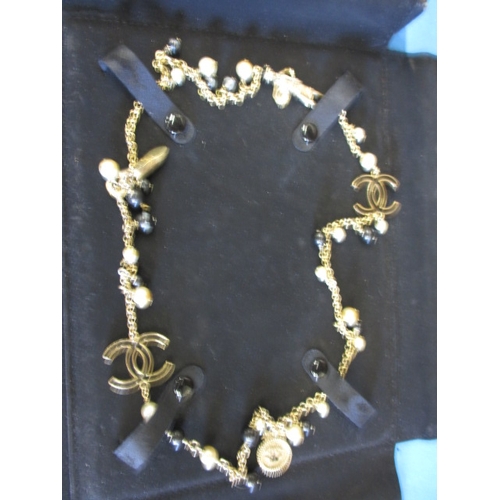 212 - A vintage costume jewellery necklace, in used condition with some enamel loss and use-related marks