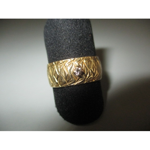 20 - A vintage 18ct yellow gold wedding band with small diamond, approx. ring size ‘N+’, approx. width 7.... 