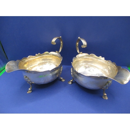 183 - A pair of antique sterling silver sauce boats, both with some minor denting, approx. gross parcel we... 