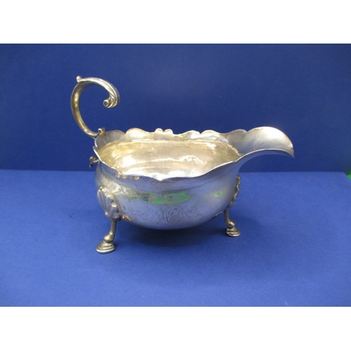 183 - A pair of antique sterling silver sauce boats, both with some minor denting, approx. gross parcel we... 