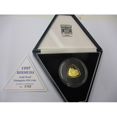 130 - A 1997 Bermuda proof gold $30 triangular coin, approx. weight 15.16g of .999 fine gold, in original ... 