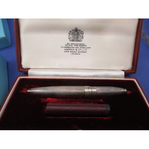 225 - Two propelling pencils, one by Tiffany and Co engraved for Coutts & Co, the other a silver example, ... 