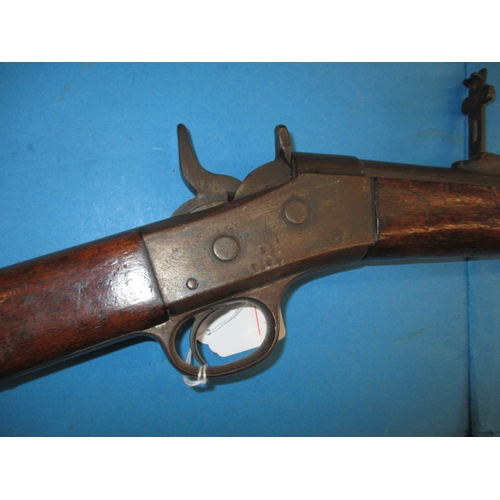 255 - An antique Remington rolling block breech rifle, approx. length 128cm, having general use related ma... 