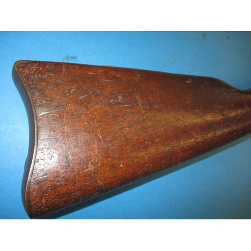 255 - An antique Remington rolling block breech rifle, approx. length 128cm, having general use related ma... 