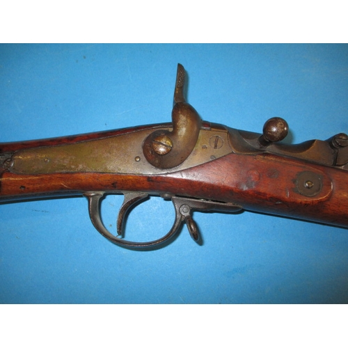 258 - An antique hammer rifle with trap door breech, approx. length 135cm pre-owned with use-related marks